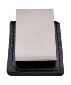 Close-up of a flat, rectangular metal blade set in a dark, textured frame.