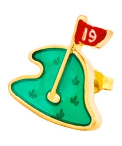 Gold enamel pin shaped like a golf green with a red flag marked '19' planted in it.