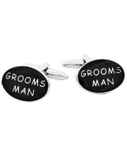 Pair of black round cufflinks with white handwritten text on the faces and silver hardware against a white background.