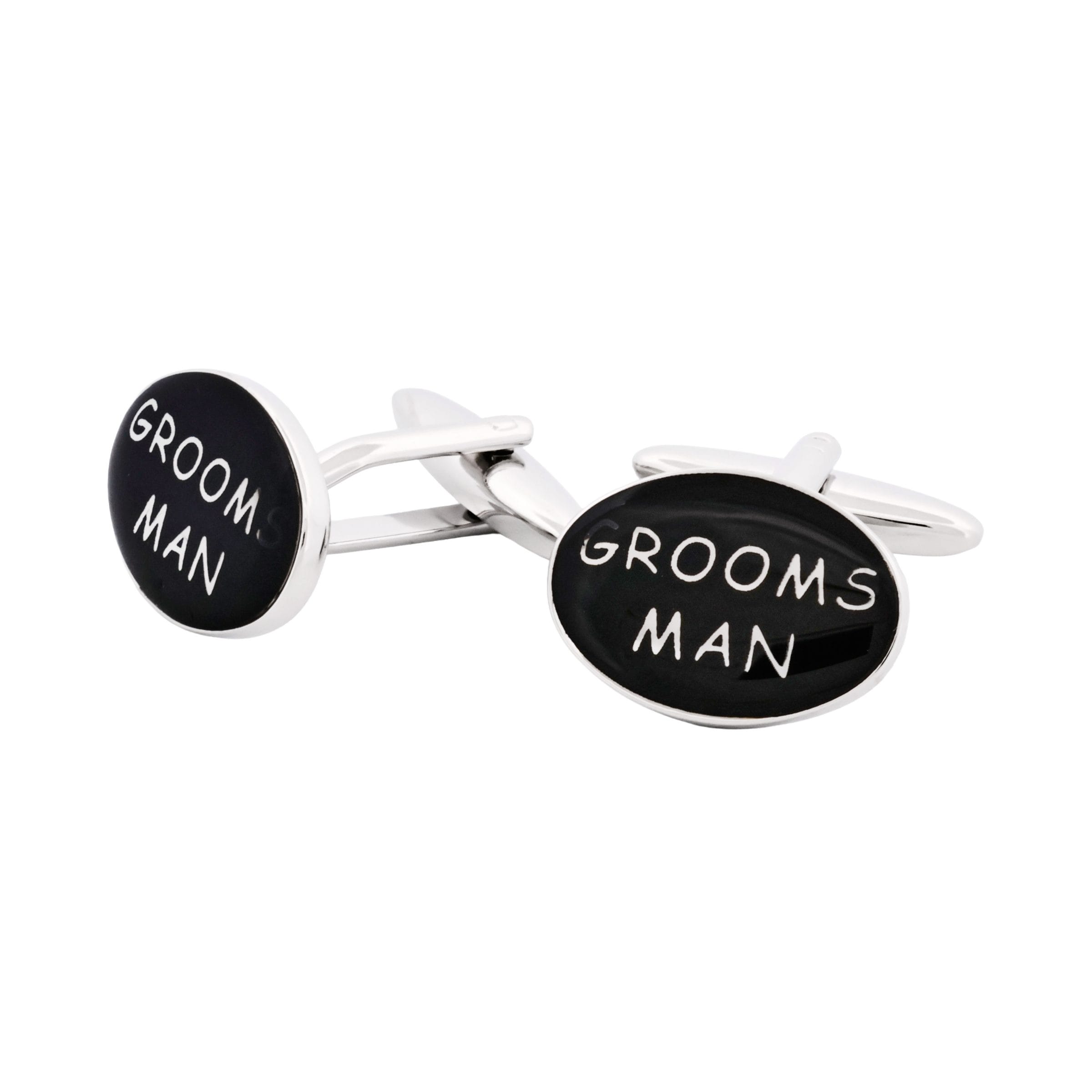 206-11E2 | Cudworth Pair of shiny cufflinks with black circular faces, each displaying white text that together reads 'GROOM' and 'MAN'.
